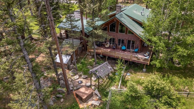 1561/1563 Colorado Gulch Dr, Helena, MT 59601 - rear view of property with a deck, a chimney, and a metal roof