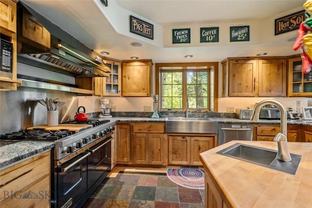 1561/1563 Colorado Gulch Dr, Helena, MT 59601 - kitchen featuring range with two ovens, brown cabinetry, glass insert cabinets, stainless steel dishwasher, and recessed lighting