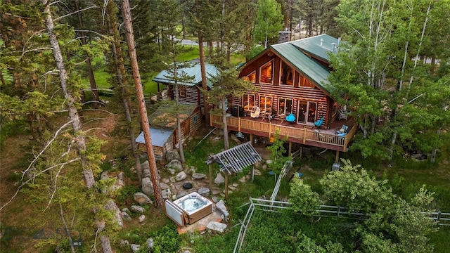 1561/1563 Colorado Gulch Dr, Helena, MT 59601 - rear view of house featuring a wooden deck and a metal roof