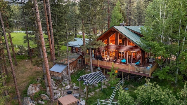 1561/1563 Colorado Gulch Dr, Helena, MT 59601 - back of house featuring a forest view, a deck, and a metal roof