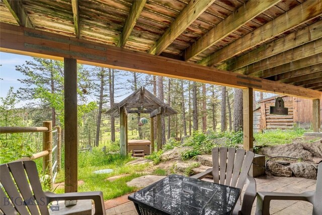 1561/1563 Colorado Gulch Dr, Helena, MT 59601 - view of patio with a hot tub