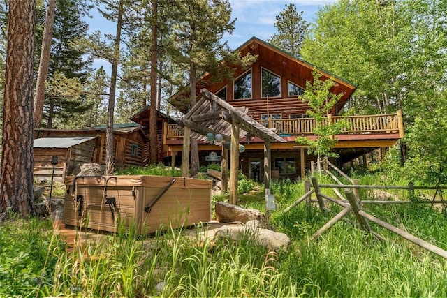 1561/1563 Colorado Gulch Dr, Helena, MT 59601 - view of play area featuring a hot tub and a wooden deck