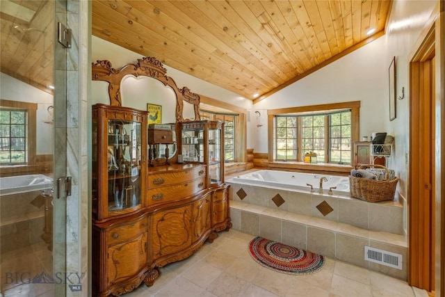 1561/1563 Colorado Gulch Dr, Helena, MT 59601 - full bathroom featuring lofted ceiling, a bath, healthy amount of natural light, wooden ceiling, and a shower stall