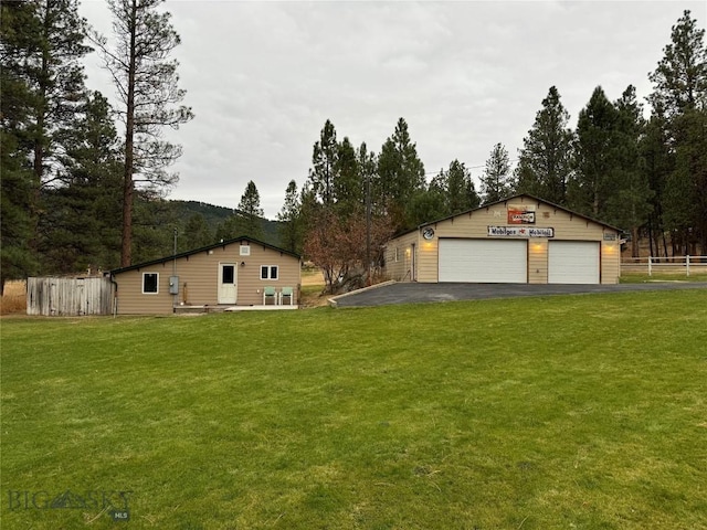 1561/1563 Colorado Gulch Dr, Helena, MT 59601 - view of yard with a detached garage and an outbuilding