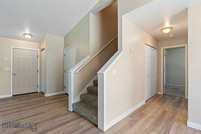2603 Snapdragon, Bozeman, MT 59718 - foyer featuring light wood-style floors, baseboards, and stairs
