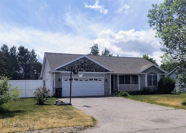 1006 E Missoula, Belgrade, MT 59714 - ranch-style home featuring a garage, driveway, roof with shingles, and covered porch