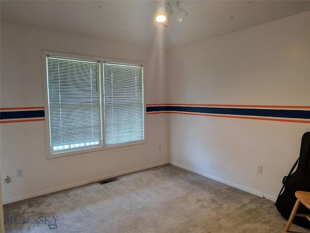 1006 E Missoula, Belgrade, MT 59714 - carpeted spare room featuring baseboards