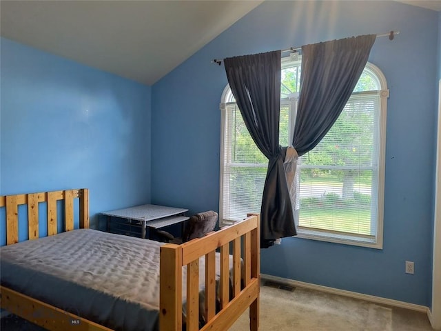 1006 E Missoula, Belgrade, MT 59714 - bedroom with carpet floors, lofted ceiling, and baseboards