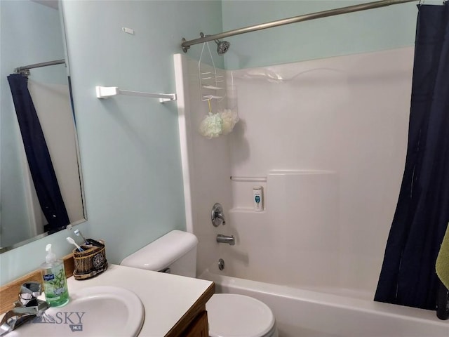 1006 E Missoula, Belgrade, MT 59714 - full bath featuring vanity, shower / bath combo with shower curtain, and toilet