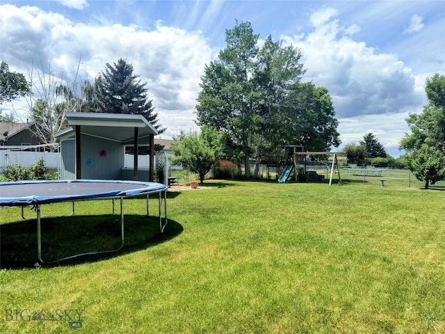 1006 E Missoula, Belgrade, MT 59714 - view of yard featuring a trampoline and a playground