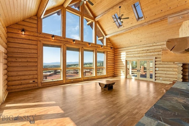 1380 Glacier View Dr, Deer Lodge, MT 59722 - unfurnished living room featuring high vaulted ceiling, a ceiling fan, a skylight, french doors, and wood ceiling with exposed beams