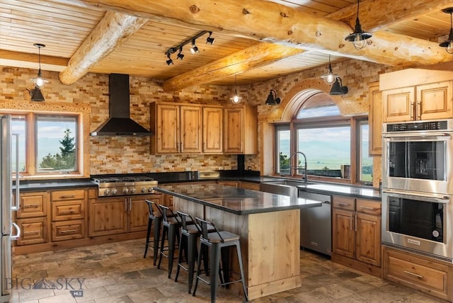 1380 Glacier View Dr, Deer Lodge, MT 59722 - kitchen featuring appliances with stainless steel finishes, wooden ceiling with exposed beams, wall chimney range hood, a sink, and brown cabinets
