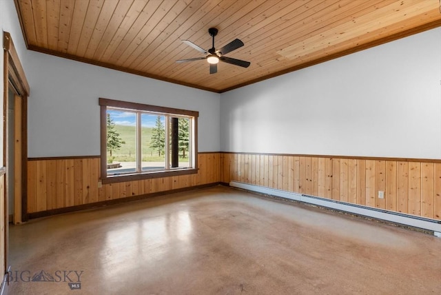 1380 Glacier View Dr, Deer Lodge, MT 59722 - empty room with baseboard heating, crown molding, a wainscoted wall, finished concrete floors, and wood walls