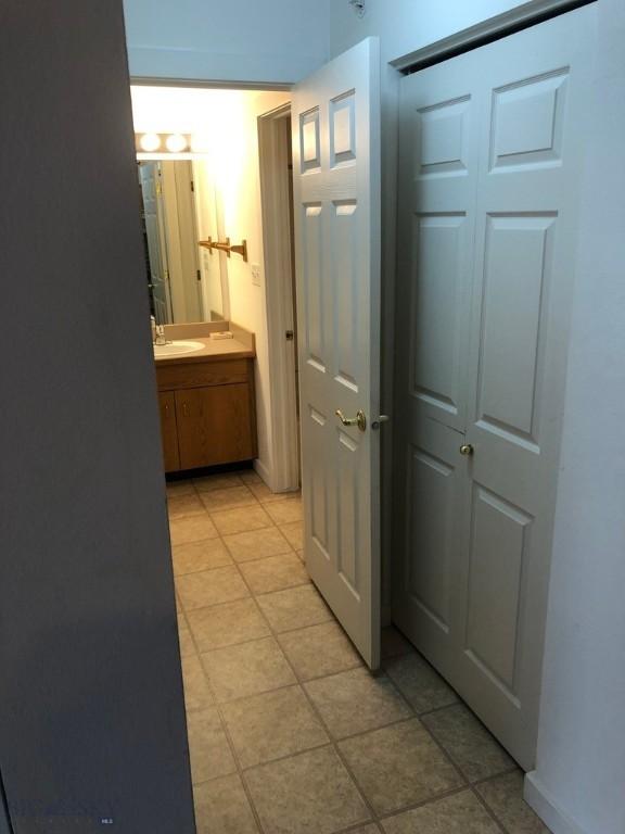 120 Firelight Dr Unit C15, Big Sky, MT 59716 - corridor featuring light tile patterned flooring
