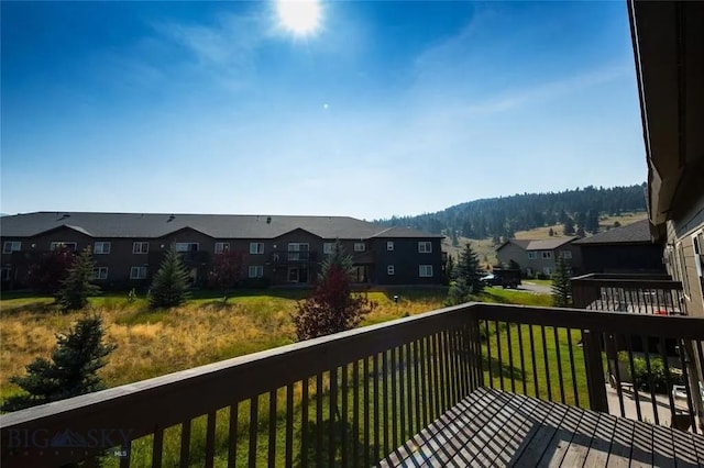 120 Firelight Dr Unit C15, Big Sky, MT 59716 - wooden deck featuring a residential view