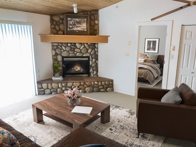 120 Firelight Dr Unit C15, Big Sky, MT 59716 - carpeted living area with wood ceiling and a stone fireplace
