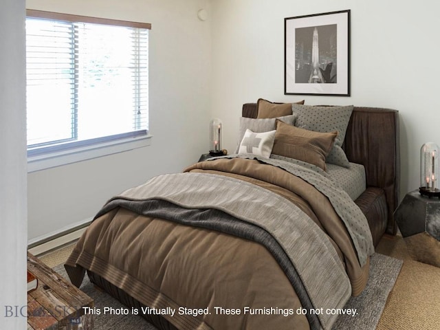 120 Firelight Dr Unit C15, Big Sky, MT 59716 - carpeted bedroom featuring a baseboard heating unit