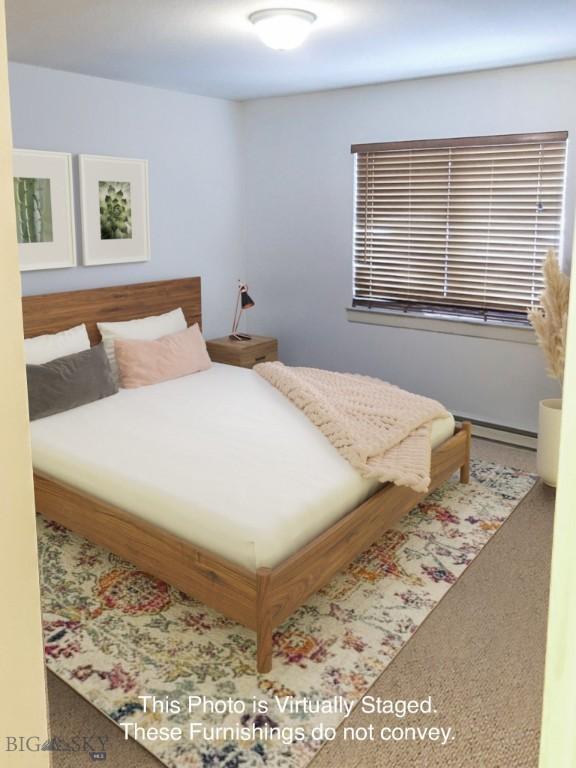 120 Firelight Dr Unit C15, Big Sky, MT 59716 - bedroom with carpet floors and baseboard heating