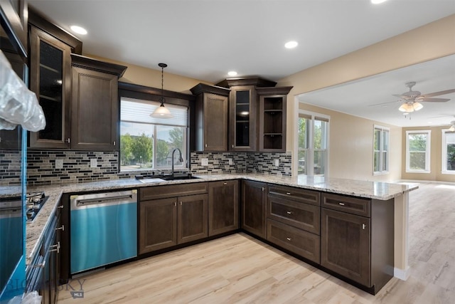 411 W 7th St, Anaconda, MT 59711 - kitchen featuring dishwashing machine, a sink, dark brown cabinetry, a peninsula, and recessed lighting