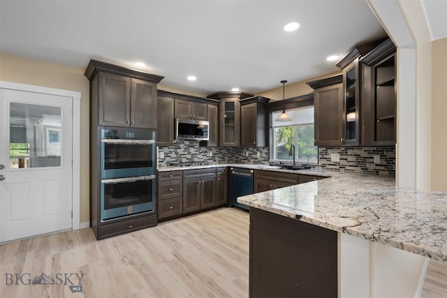 411 W 7th St, Anaconda, MT 59711 - kitchen with stainless steel appliances, dark brown cabinetry, a peninsula, and recessed lighting