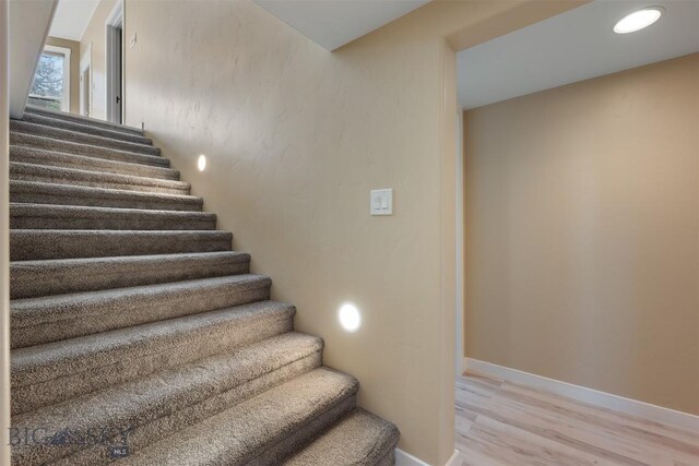 411 W 7th St, Anaconda, MT 59711 - stairway featuring wood finished floors and baseboards