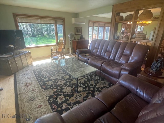 13 Shefield Dr, Ennis, MT 59729 - living room with a wall unit AC, healthy amount of natural light, wood finished floors, and baseboards