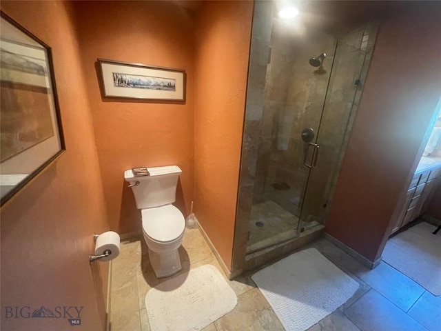 13 Shefield Dr, Ennis, MT 59729 - bathroom with a stall shower, toilet, and tile patterned floors