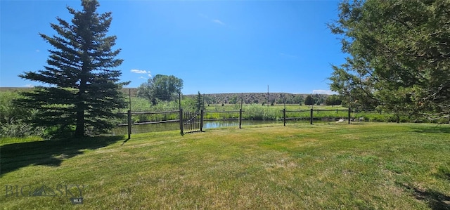 13 Shefield Dr, Ennis, MT 59729 - view of green lawn featuring a view of countryside and a water view