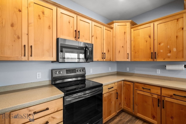 4716 Shadowglen Dr Unit B, Bozeman, MT 59718 - kitchen with black electric range oven, light countertops, dark wood-type flooring, and light brown cabinetry