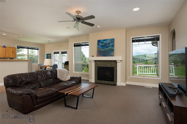 15 Blue Grouse Ct, Bozeman, MT 59715 - living room featuring a fireplace, ceiling fan, recessed lighting, baseboards, and dark carpet