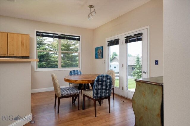 15 Blue Grouse Ct, Bozeman, MT 59715 - dining area featuring light wood-style floors and baseboards