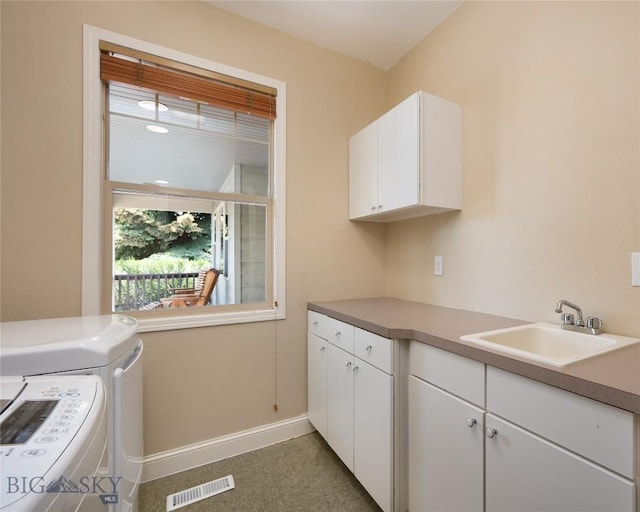15 Blue Grouse Ct, Bozeman, MT 59715 - laundry room with cabinet space, washing machine and dryer, and baseboards