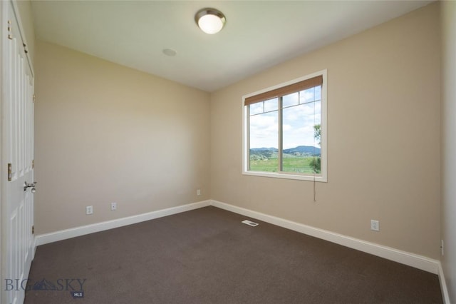 15 Blue Grouse Ct, Bozeman, MT 59715 - empty room featuring baseboards and dark carpet