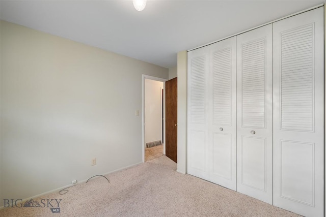 303 Sharon Ct, Anaconda, MT 59711 - unfurnished bedroom with carpet floors, a closet, and baseboards
