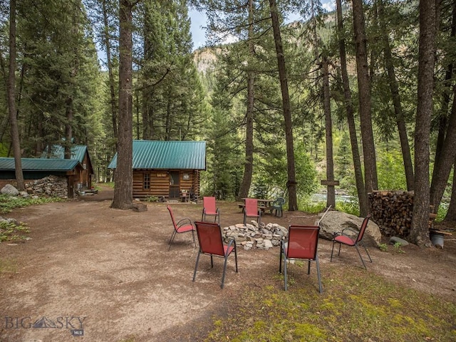 64370 Gallatin Rd, Gallatin Gateway, MT 59730 - view of patio / terrace featuring a view of trees
