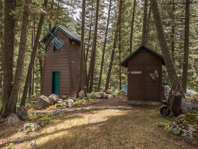 64370 Gallatin Rd, Gallatin Gateway, MT 59730 - view of yard with a shed and a wooded view