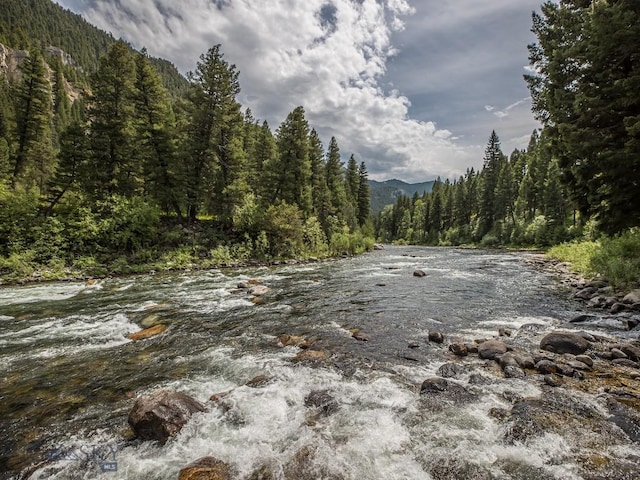 64370 Gallatin Rd, Gallatin Gateway, MT 59730 - water view featuring a forest and mountains