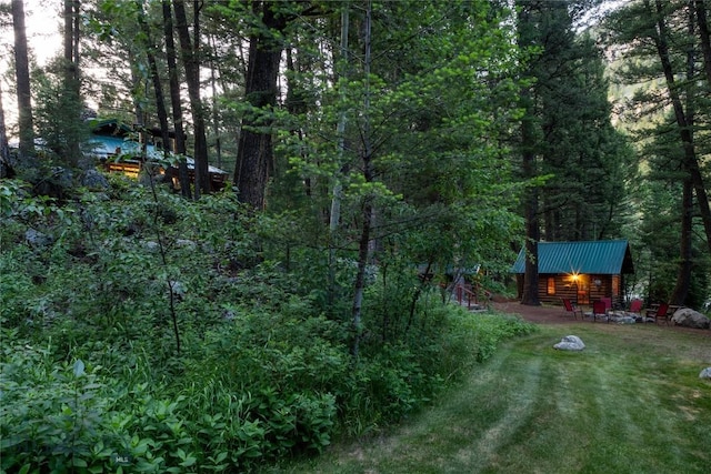 64370 Gallatin Rd, Gallatin Gateway, MT 59730 - view of grassy yard with a forest view