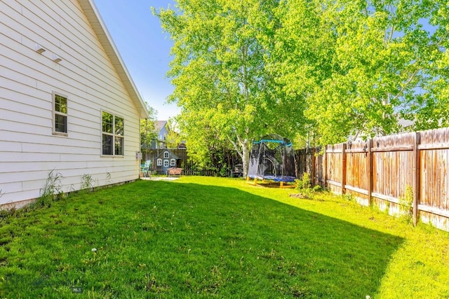85 Shallow Brook Ln, Belgrade, MT 59714 - fenced backyard with a trampoline