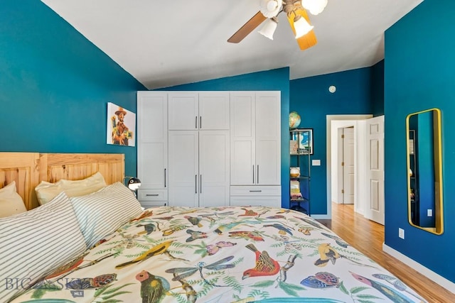 85 Shallow Brook Ln, Belgrade, MT 59714 - bedroom with vaulted ceiling, wood finished floors, a closet, and ceiling fan