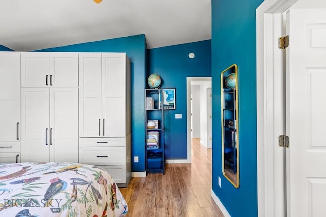 85 Shallow Brook Ln, Belgrade, MT 59714 - bedroom with lofted ceiling and light wood-type flooring