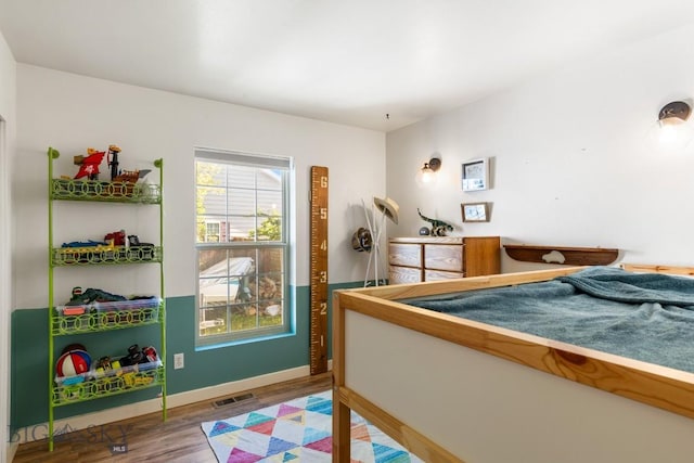 85 Shallow Brook Ln, Belgrade, MT 59714 - bedroom with wood finished floors and baseboards