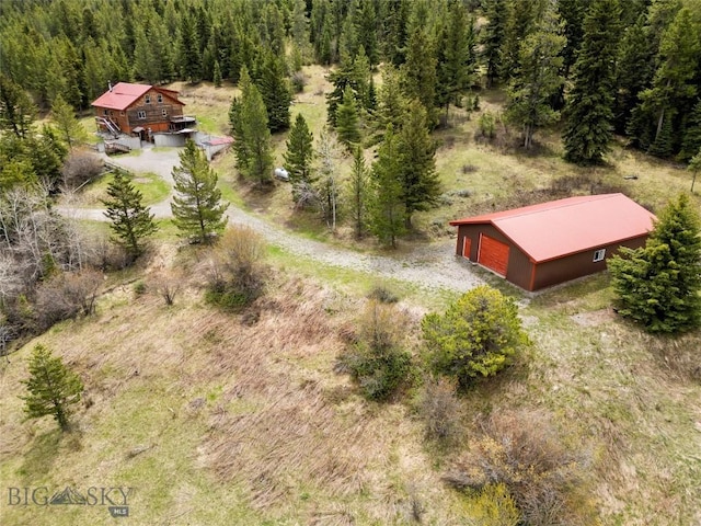 3030 Woodchuck Rd, Bozeman, MT 59715 - aerial view of property and surrounding area with a heavily wooded area
