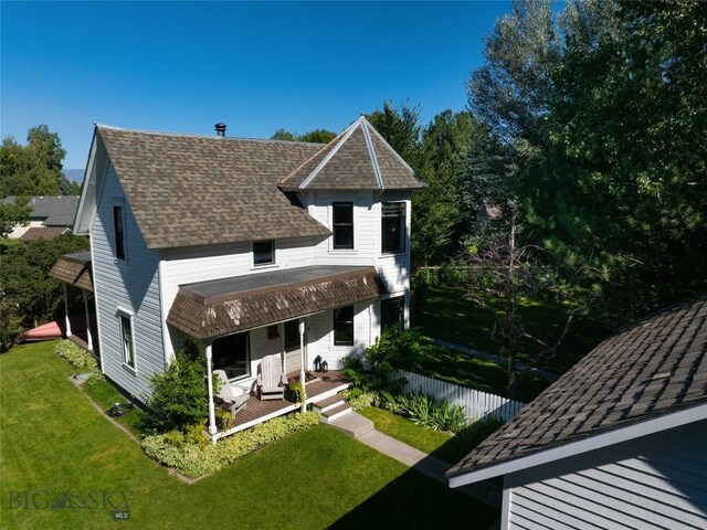 311 N 6th St, Manhattan, MT 59741 - back of house featuring a lawn, a porch, and a shingled roof