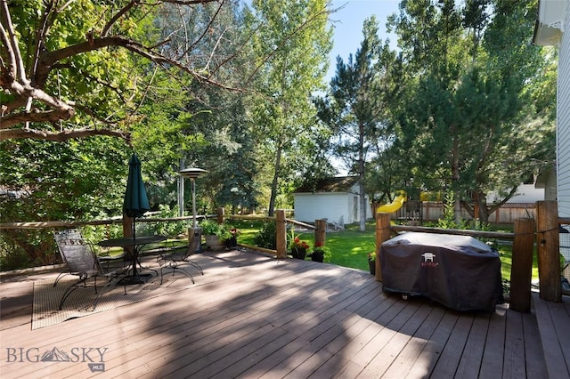 311 N 6th St, Manhattan, MT 59741 - wooden deck with outdoor dining space and area for grilling