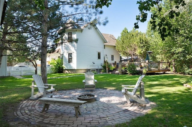 311 N 6th St, Manhattan, MT 59741 - rear view of house featuring a fire pit, a patio, and a wooden deck