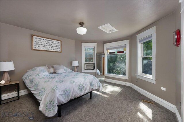 311 N 6th St, Manhattan, MT 59741 - carpeted bedroom with baseboards and cooling unit