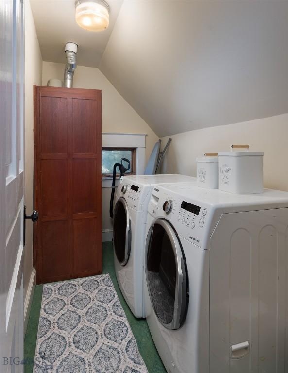 311 N 6th St, Manhattan, MT 59741 - laundry room with washer and dryer and light carpet