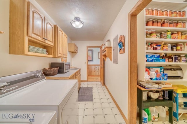 886 Wierda Way, Manhattan, MT 59741 - laundry area with washer and clothes dryer, light flooring, cabinet space, and a textured ceiling