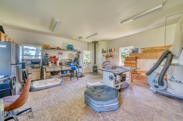 886 Wierda Way, Manhattan, MT 59741 - miscellaneous room with healthy amount of natural light and a wood stove